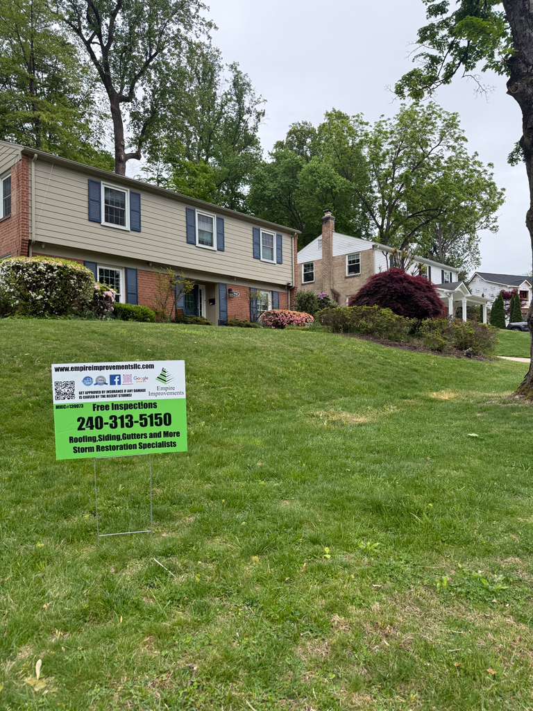 Roofer installing shingles